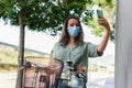 Young girl with glasses and mask making a selfie