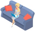 Young girl in glasses sitting with laptop on sofa serfing in internet, training, education online