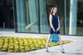 Young girl goes for shopping on the street. Royalty Free Stock Photo