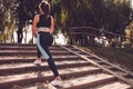 A young girl goes in for sports outdoors in the park. Outdoor sports