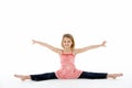Young Girl In Gymnastic Pose Doing Splits Royalty Free Stock Photo