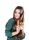 Young girl with hairbrush isolated