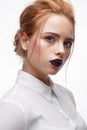 Young girl with a haircut in a white shirt. Beautiful model with nude make-up and bright lips. Office Style Royalty Free Stock Photo