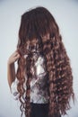 Young girl hand long hair