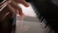 Young girl hand playing piano