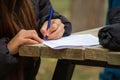Young girl hands filling out forms. Young girl writing Royalty Free Stock Photo