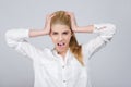 Young girl with hands on her head being desperate screaming. Royalty Free Stock Photo