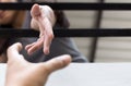 Young girl Hands reaching out from metal bars helping people Royalty Free Stock Photo