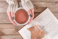 Autumn Delights: Tea, Books, and Falling Leaves Royalty Free Stock Photo