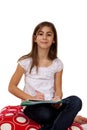 Young Girl Happily Doing Her Homework