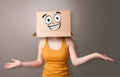 Young girl with happy cardboard box face