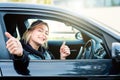 Young girl happy seated in her new car Royalty Free Stock Photo