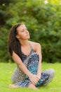 Young girl has rest on lawn