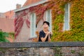 Young girl in hat at bridge in Bruges Royalty Free Stock Photo