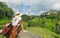 Young girl with hat  looking the ricefields. Rice terraces famous place Tegallalang near Ubud. The island Bali in indonesia in Royalty Free Stock Photo