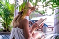 Girl reading a book on the beach Royalty Free Stock Photo