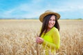 young girl in a hat in a wheat field Royalty Free Stock Photo