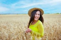 young girl in a hat in a wheat field Royalty Free Stock Photo