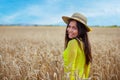 young girl in a hat in a wheat field Royalty Free Stock Photo