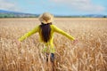 young girl in a hat in a wheat field Royalty Free Stock Photo