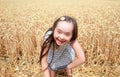 Young girl have fun in wheat field Royalty Free Stock Photo