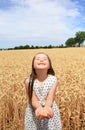 Young girl have fun in wheat field Royalty Free Stock Photo