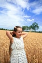 Young girl have fun in wheat field Royalty Free Stock Photo