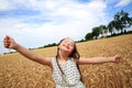 Young girl have fun in wheat field