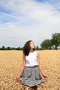 Young girl have fun in wheat field Royalty Free Stock Photo