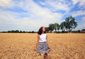 Young girl have fun in the wheat field Royalty Free Stock Photo