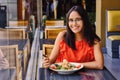 Latinamerican girl have a lunch in restaurant Royalty Free Stock Photo