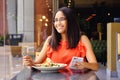 Latinamerican girl have a lunch in restaurant Royalty Free Stock Photo