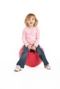 Young Girl Having Fun On Inflatable Hopper Royalty Free Stock Photo