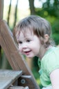 Young girl having fun on a swing set Royalty Free Stock Photo