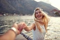 A young girl is having a good time with her boyfriend on the seaside. Love, relationship, holiday, sea Royalty Free Stock Photo