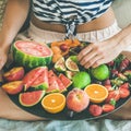 Young girl having healthy fruit breakfast in bed, square crop Royalty Free Stock Photo