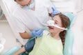 Lovely young girl at dental checkup at the clinic Royalty Free Stock Photo