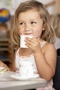 Young Girl Having Tea at Montessori/Pre-School Royalty Free Stock Photo