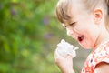 Young Girl With Hayfever Sneezing In Garden