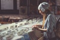 Young girl with headphones browsing records Royalty Free Stock Photo