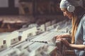 Young girl with headphones browsing vinyl records Royalty Free Stock Photo