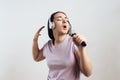 Young girl in headphones expressively sings Royalty Free Stock Photo