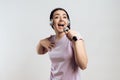 Young girl in headphones expressively sings Royalty Free Stock Photo