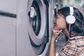 Young girl at a washing machine Royalty Free Stock Photo