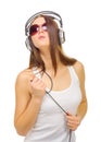 Young girl hear music by headphones
