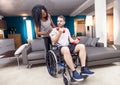 Young girl helps a disabled to rised dumbbells Royalty Free Stock Photo