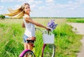 Young girl with her bike outdoors Royalty Free Stock Photo