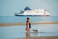 young girl is her mom walking on the beaches of northern France Royalty Free Stock Photo