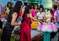 Young Girl and Her Mother Bathing the Buddha During Vesak Day