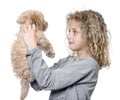 Young girl with her toy Poodle puppy (9 weeks old) Royalty Free Stock Photo